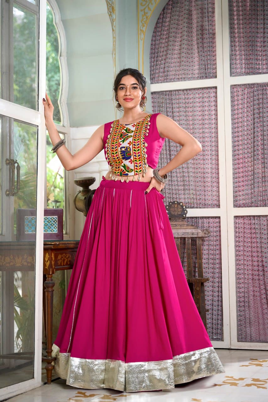 Woman in vibrant pink lehenga and traditional Gamthi work blouse – perfect Navratri outfit


