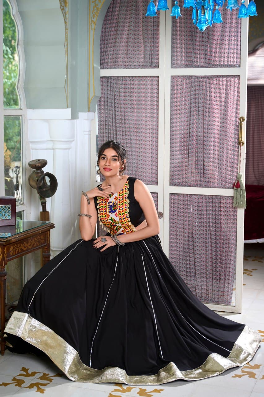 Woman wearing black rayon lehenga with gamthi blouse and lace details – Navratri special